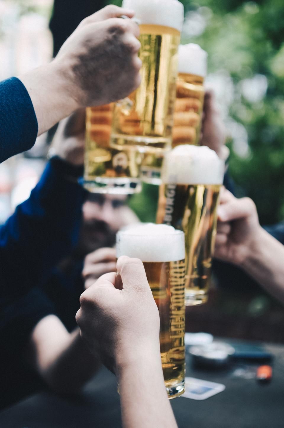 Two pints raised in a toast