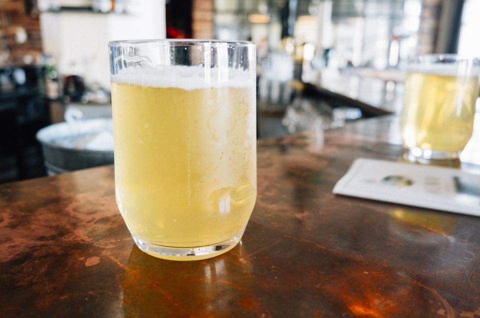 A cloudy wheat beer on the bar